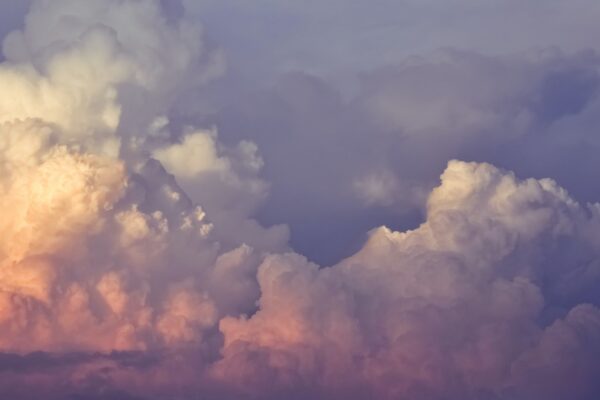 Vibrant, colorful clouds during sunset, creating a serene and dreamy atmosphere.